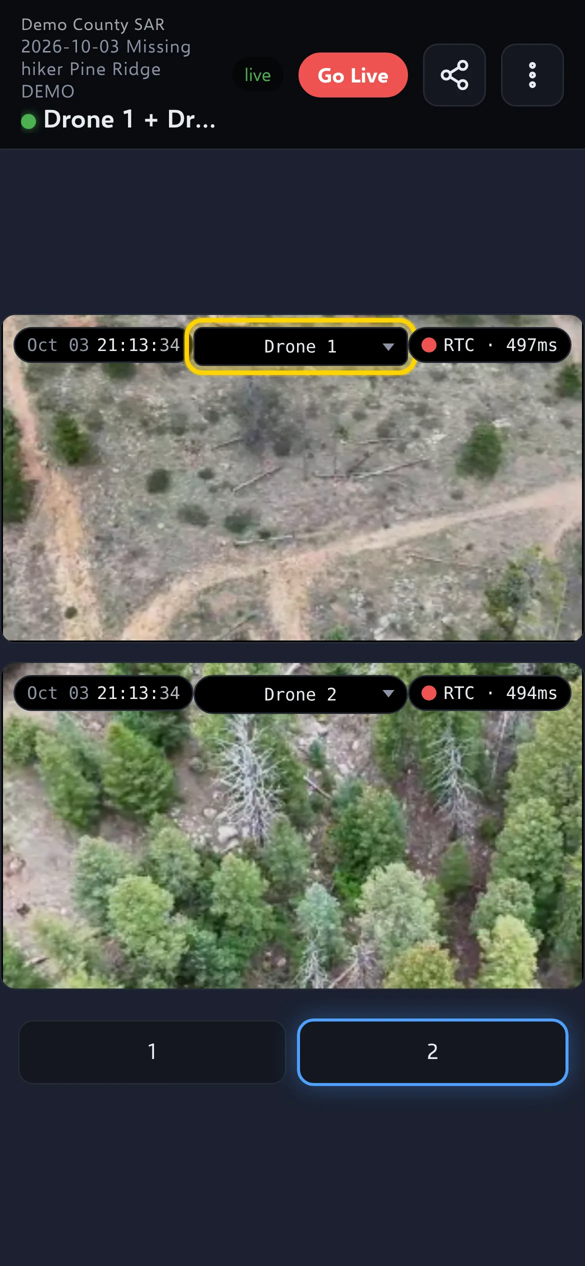 The viewer on a phone: two live drone feeds, one above the other, with the first feed's drop-down (Drone 1) outlined; the status at the top says live